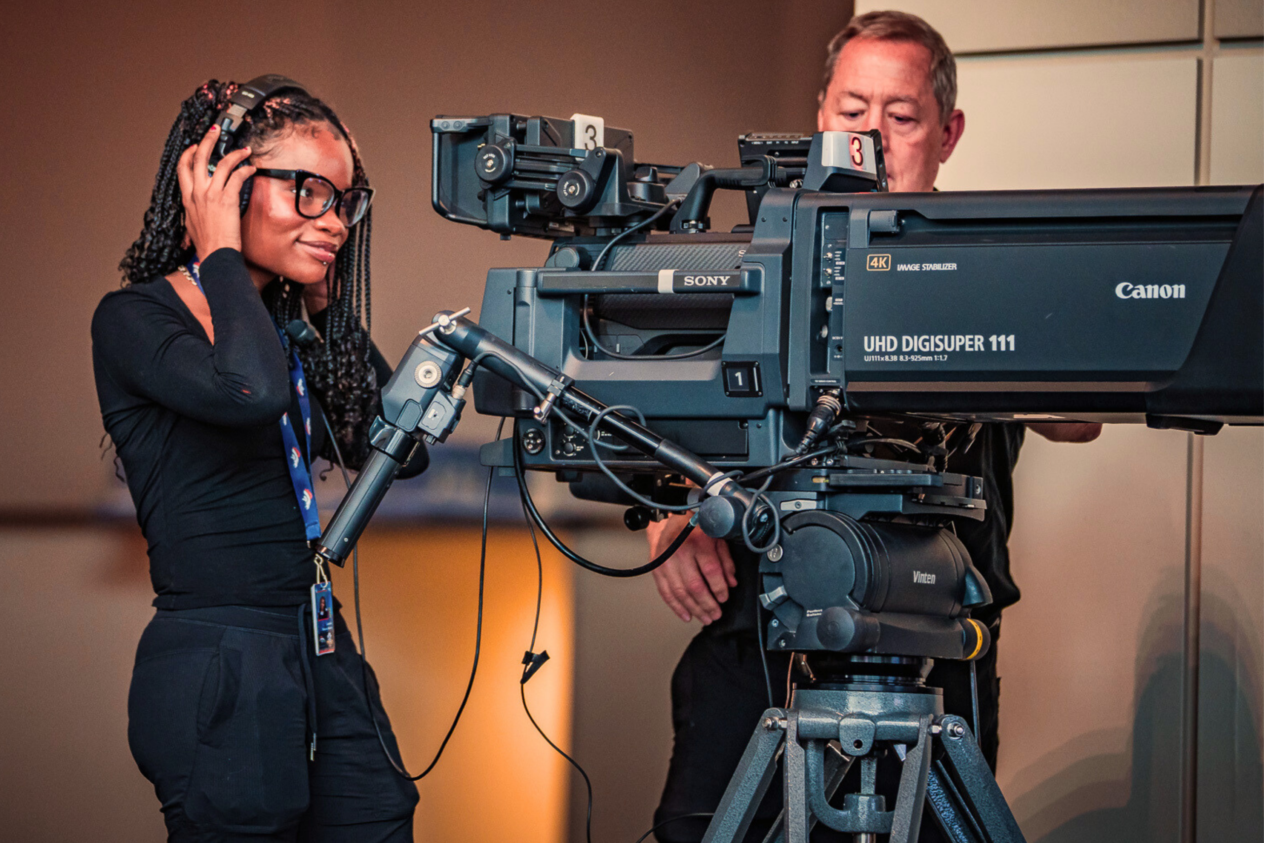 Women behinf Canon UHD Digisuper 111