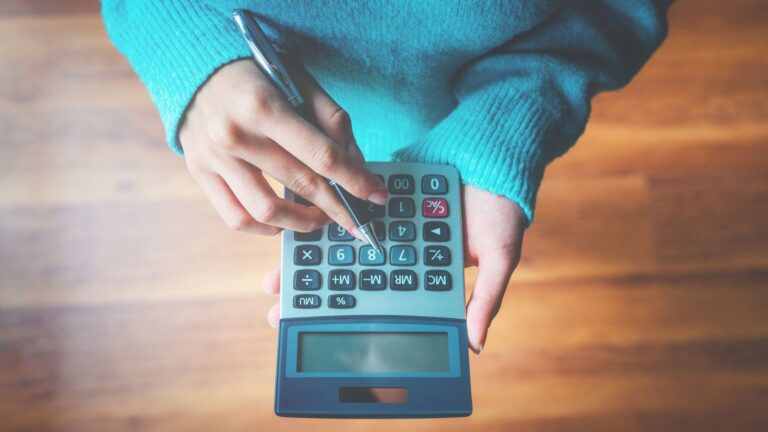 woman-holding-calculator