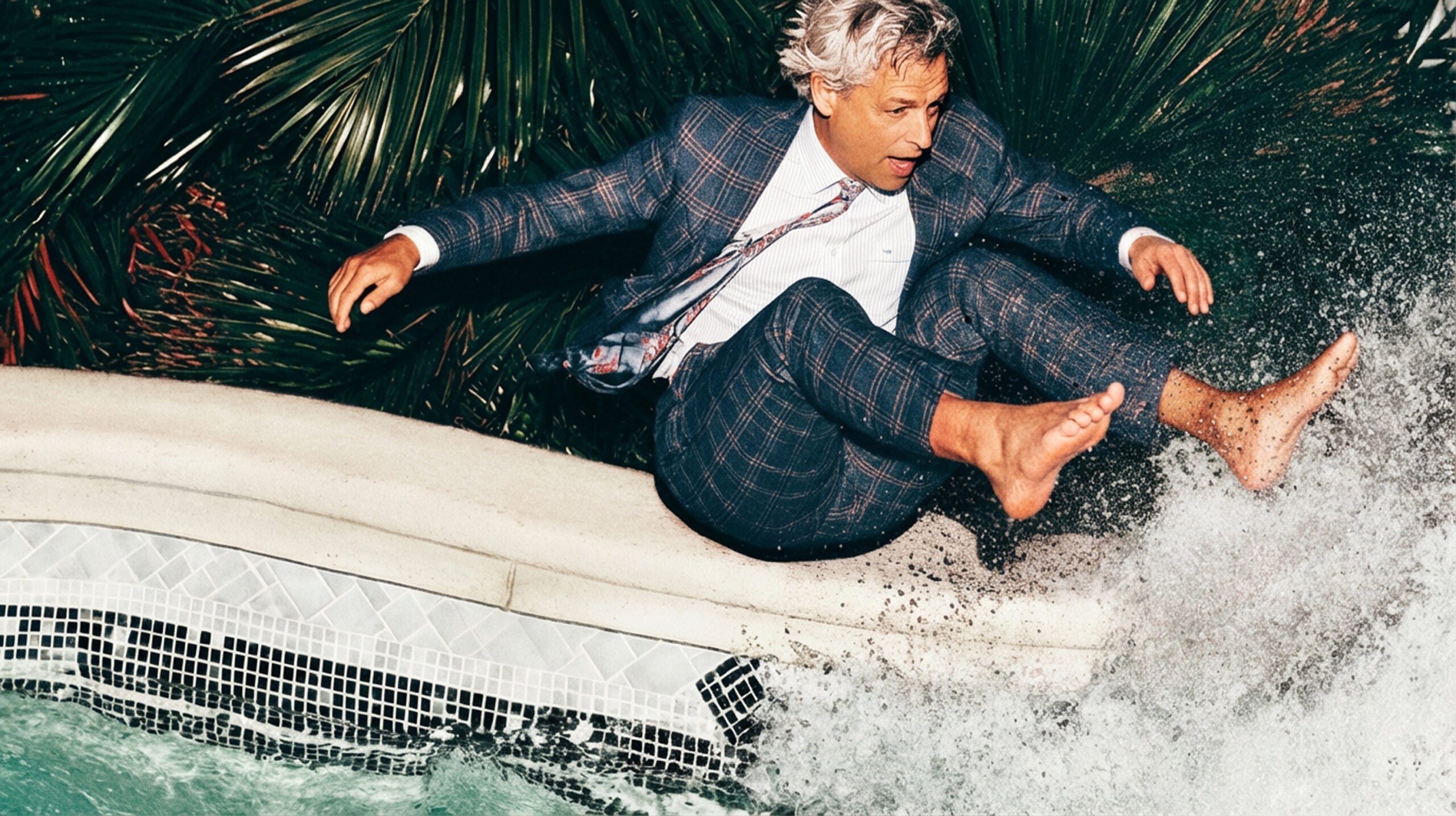 A man jumping in a pool