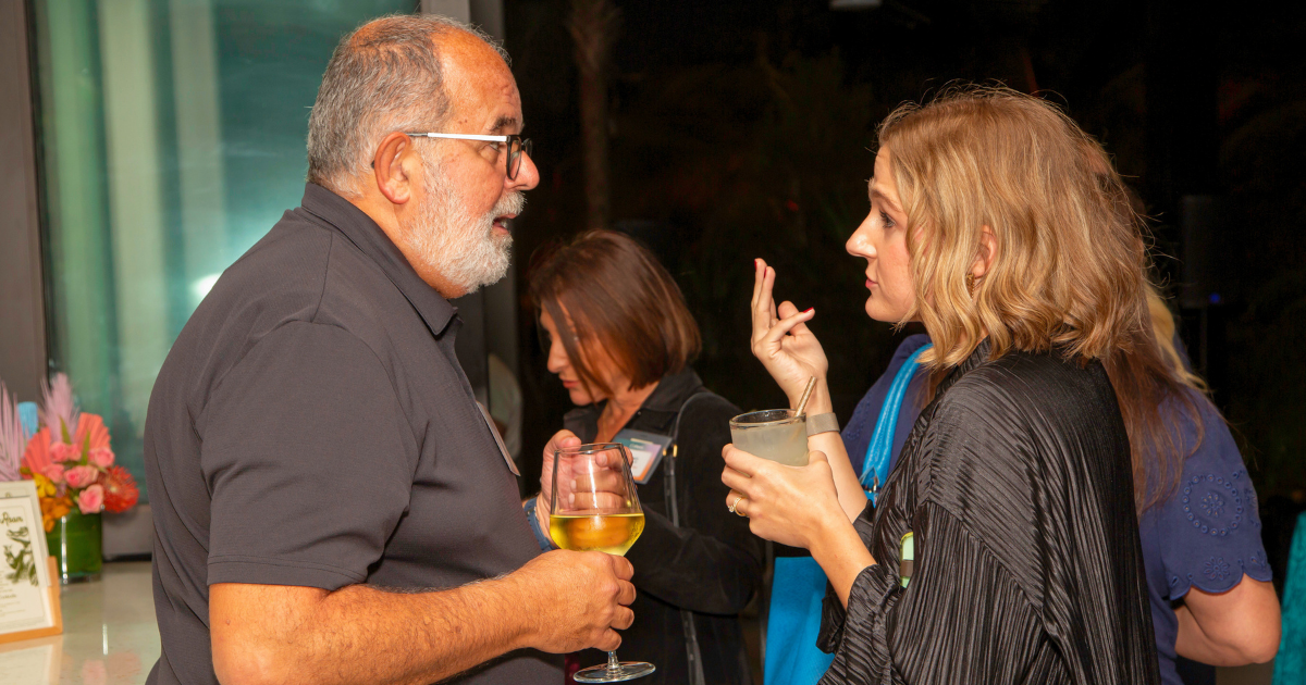 Different generations interacting at a corporate event